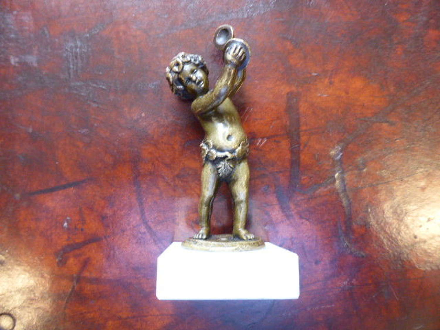 Small Bronze Putti Desk Ornament. 18th c.