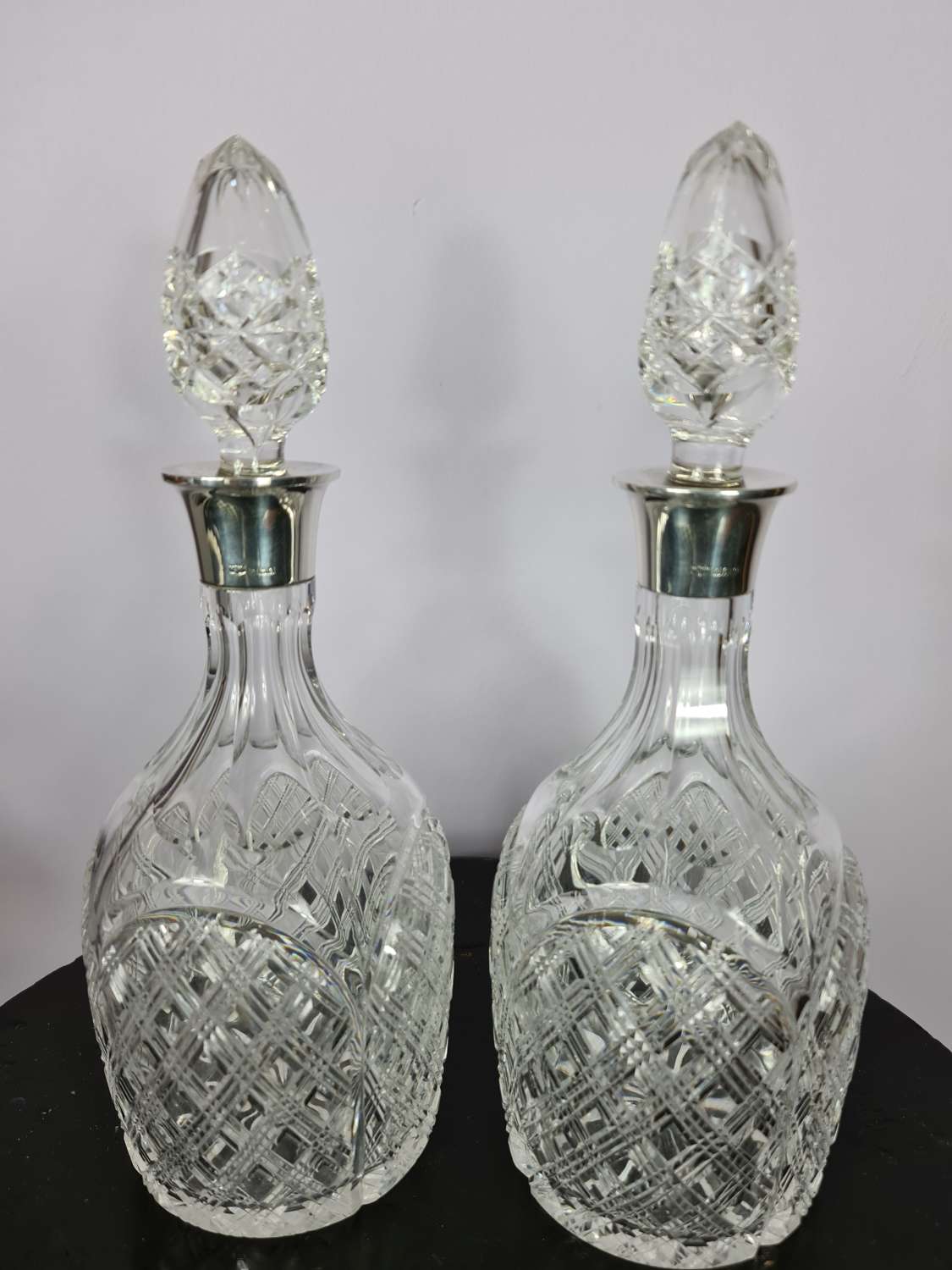 Elegant pair of Silver collared Decanters by Mappin & Webb
