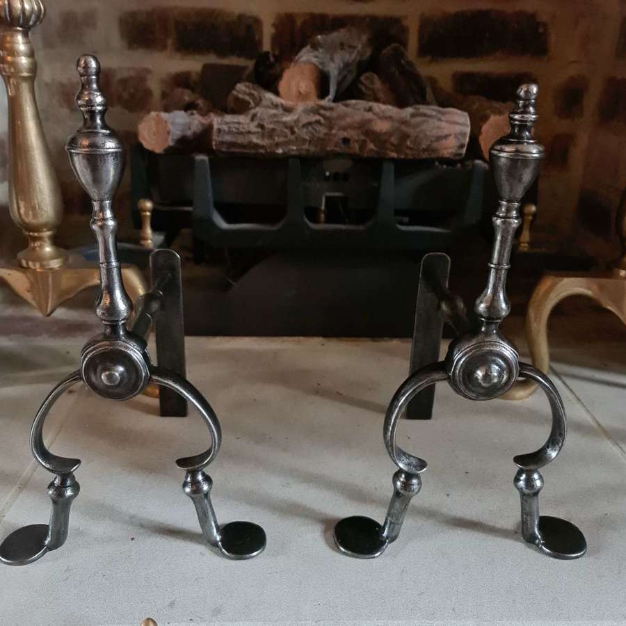 A Pair of George III Burnished Steel Fire Dogs