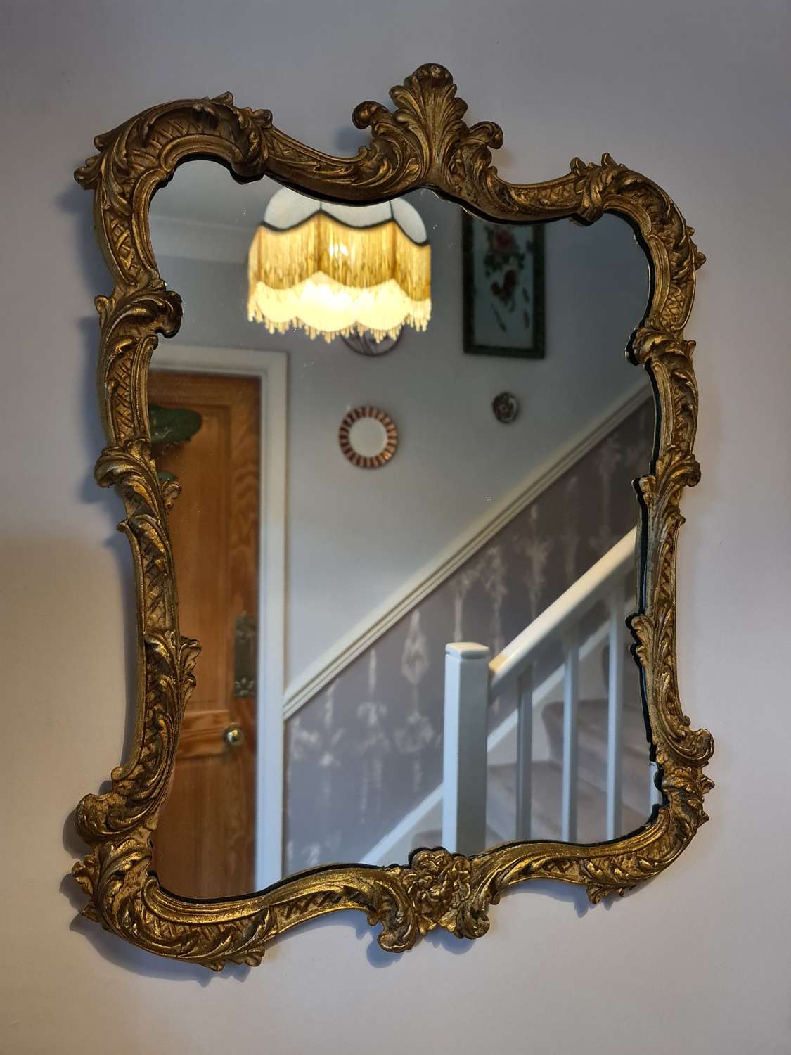 Good Wall Mirror with gilt metal frame in Rococo style