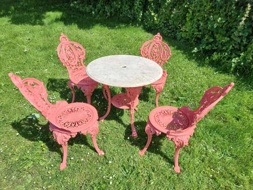Set of Four Cast-iron Garden Chairs together with a cast-iron Table