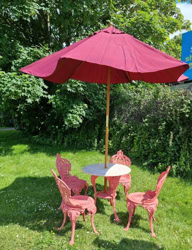 Set of Four Cast-iron Garden Chairs together with a cast-iron Table