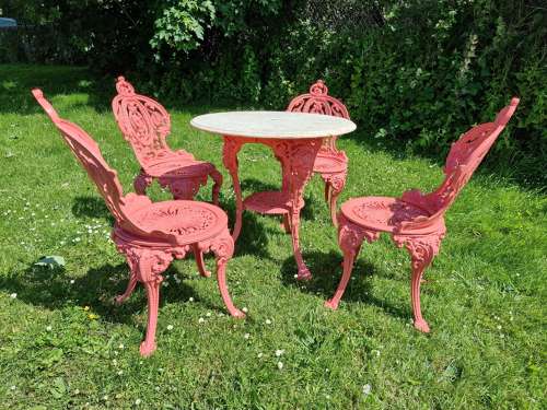 Set of Four Cast-iron Garden Chairs together with a cast-iron Table