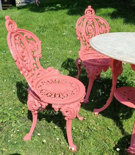 Set of Four Cast-iron Garden Chairs together with a cast-iron Table