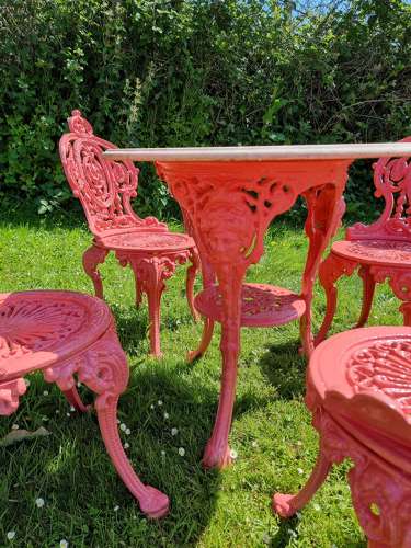 Set of Four Cast-iron Garden Chairs together with a cast-iron Table