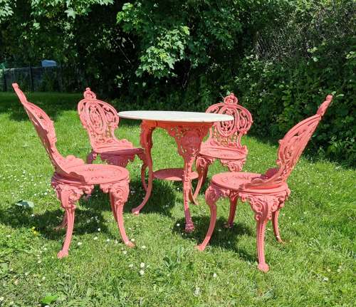 Set of Four Cast-iron Garden Chairs together with a cast-iron Table