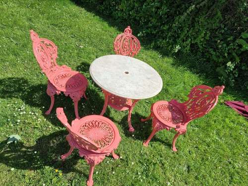 Set of Four Cast-iron Garden Chairs together with a cast-iron Table